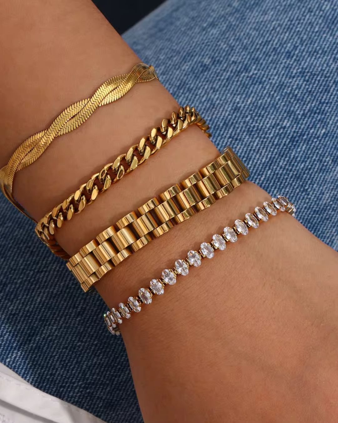 Glow Getter bracelet with sparkling CZ stones in gold, styled in a bracelet stack for women as luxury arm candy and statement jewelry.