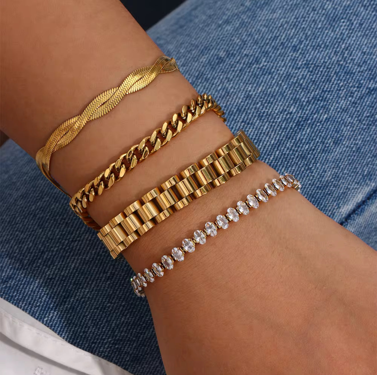 Luxe Link bracelet in polished gold stainless steel, styled in a layered bracelet stack for women. A bold chunky chain design with modern luxury vibes.