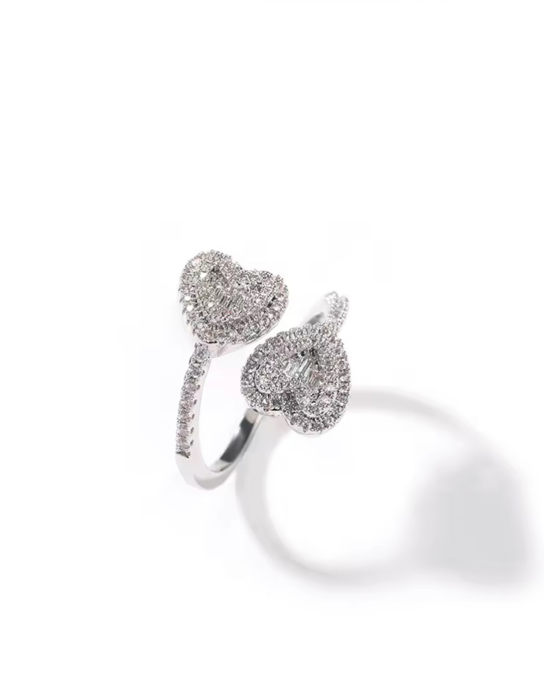 Queen of Hearts ring in silver with double CZ heart design. Elegant tennis-inspired sparkle crafted as a modern luxury ring for women with timeless romantic vibes.