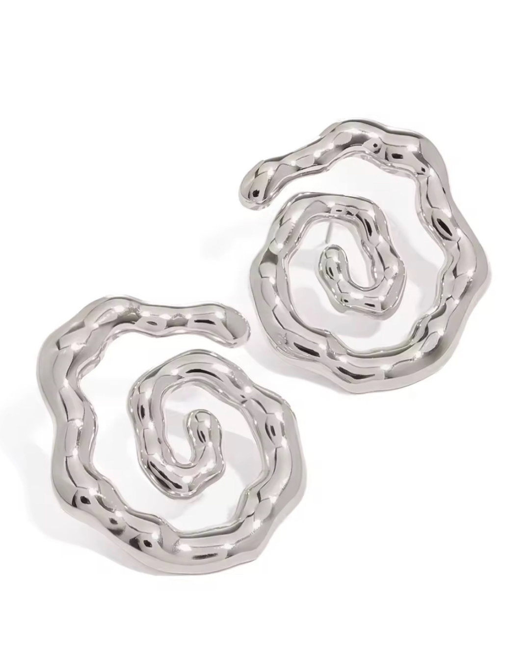 Twist of Faith earrings in polished silver, luxury sculptural circle hoops for women with modern statement style and versatile everyday-to-evening vibes.