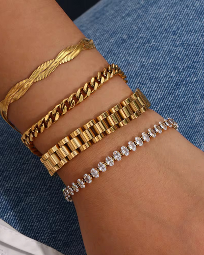 Glow Getter bracelet with sparkling CZ stones in gold, styled in a bracelet stack for women as luxury arm candy and statement jewelry. 