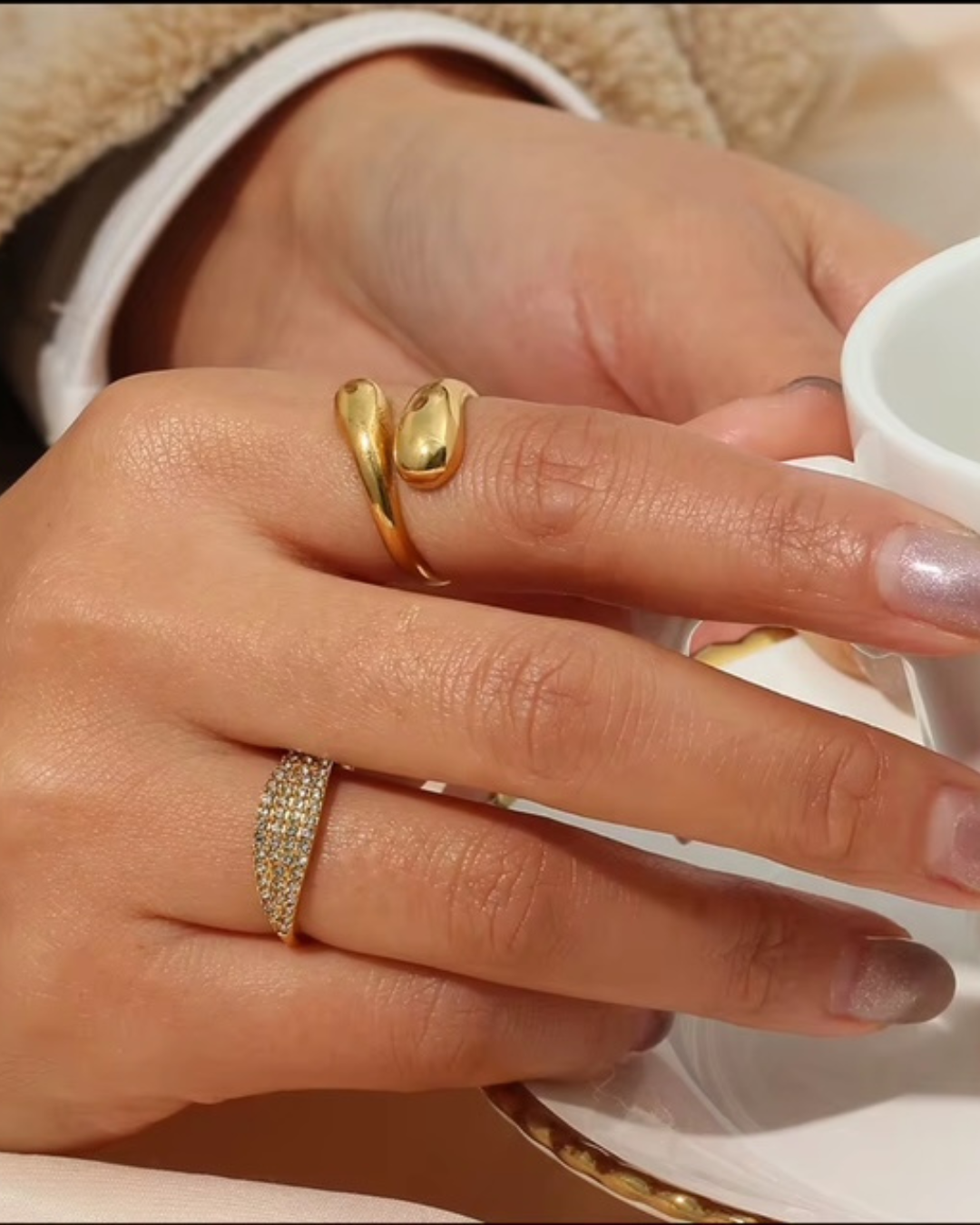 Gold Rich AF ring worn during a cozy coffee moment--an everyday statement piece for women who crave quiet luxury and bold femininity. 