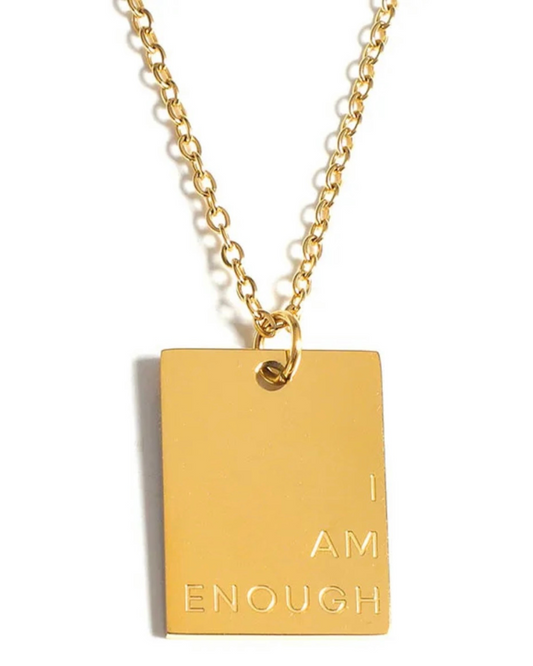 Close-up of the gold I Am Enough necklace on white background. A minimalist, dainty affirmation piece for everyday wear by women who know their worth.