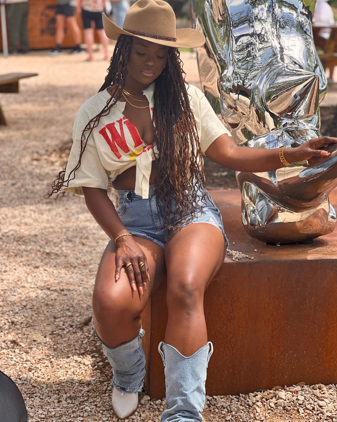 Bold, confident, and draped in denim boots--this luxe beauty radiates main character energy wearing the Rich  AF Ring and Timeless Ropes bracelet, styled effortlessly with a western-chic twist. 