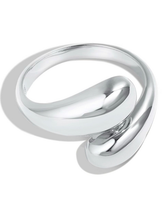 Polished silver sculptural ring with a bold, fluid design. A minimalist statement piece for everyday wear by stylish women. 