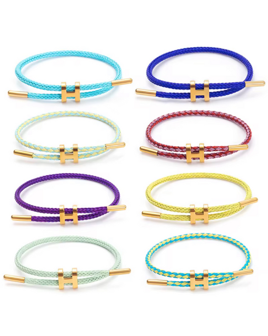 Stacked Like a Horse bracelets in multiple colors with braided leather design and gold H hardware. Bold statement jewelry for women with vibrant luxury vibes. Stack 1 or 10. 