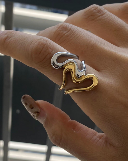 Close-up of the Untamed Ring in two-tone gold and silver, a bold sculptural statement piece worn on the hand, designed to embody fearless style and modern edge.