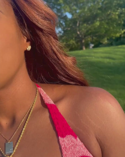 Tik Tok video of the I Am Luxury Accessories Boutique owner wearing the flower cluster gold screw back earrings.