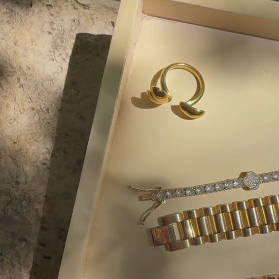 Close-up poolside video showcasing the Wave Runner Ring in gold, catching the light with every movement — perfect for summer vacation and resort style looks.